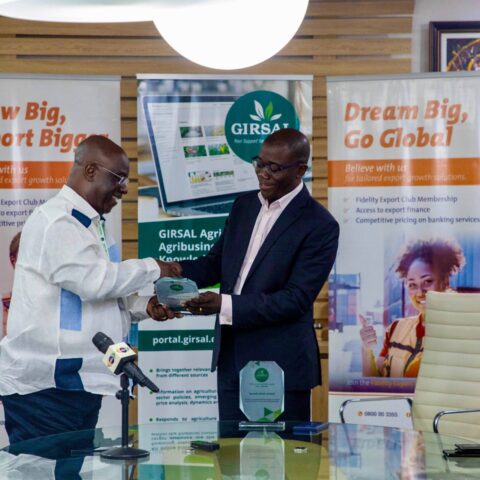 Kwesi-Korboe-CEO-of-GIRSAL-presents-an-award-to-Julian-Opuni-MD-of-Fidelity-Bank