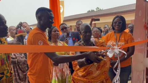 Nana-Bepow-I-Chief-of-Nyameyekrom-being-assisted-by-Eric-Osei-to-officially-commission-the-renovated-school