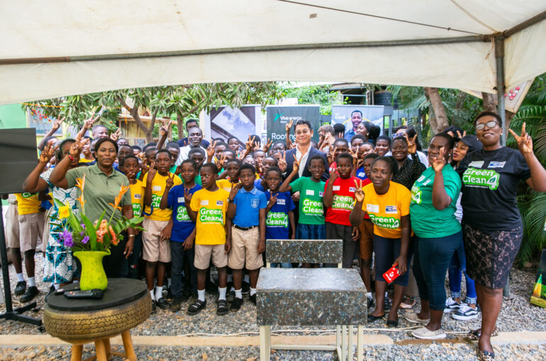 A group picture of Christian Li, MD of Vivo Energy Ghana and the pupils from La Enobal Basic School during the educational visit at Mckingtorch Africa.