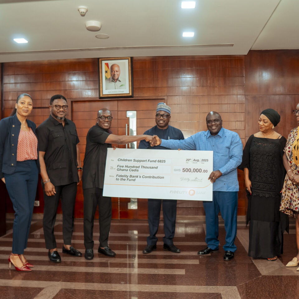 Kwabena Boateng, Deputy Managing Director, Fidelity Bank, handing over the cheque to Chief of Staff Hon. Julius Debrah