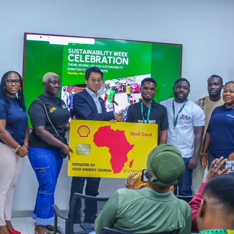 Mr. Christian Li, Managing Director of Vivo Energy Ghana PLC Presenting a Dummy Shell card to the Buz Stop Boys.